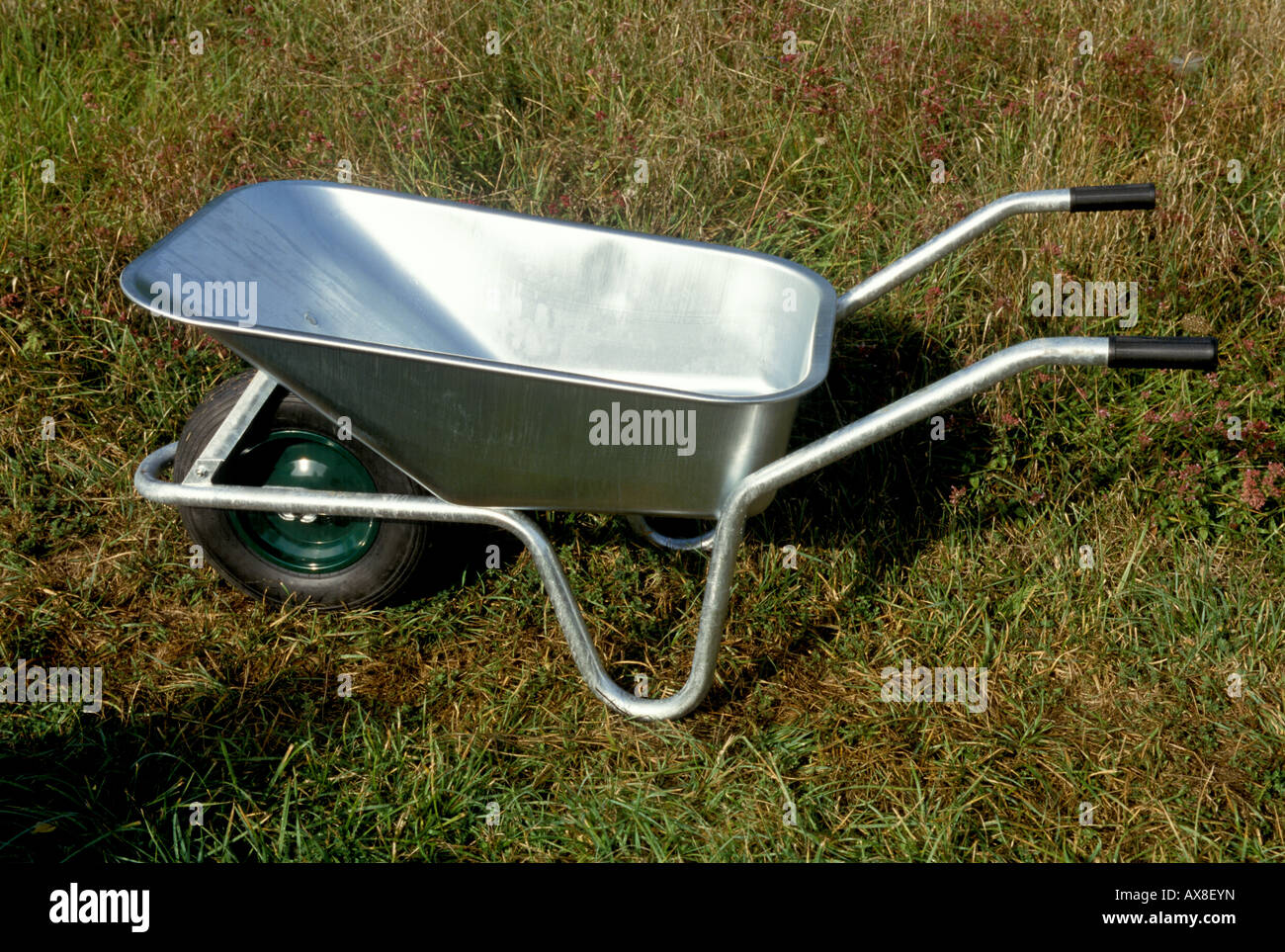 a new galvanized wheelbarrow Stock Photo Alamy