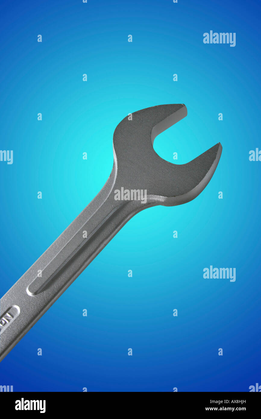 Wrench with a clipping path isolated on blue Stock Photo