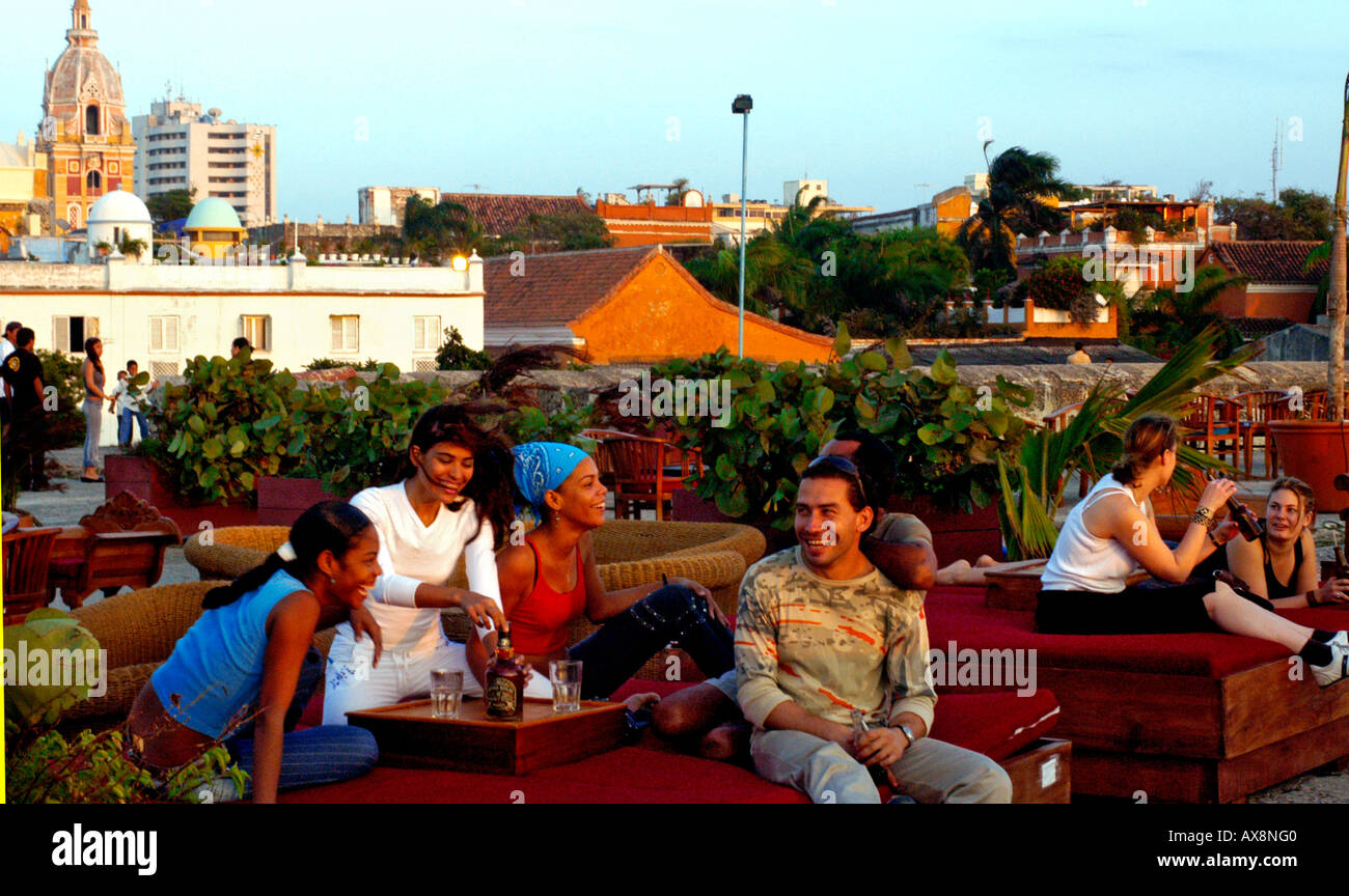 Laughing people on the terrace of the Cafe del Mar, Cartagena de Indias, Colombia, South America Stock Photo