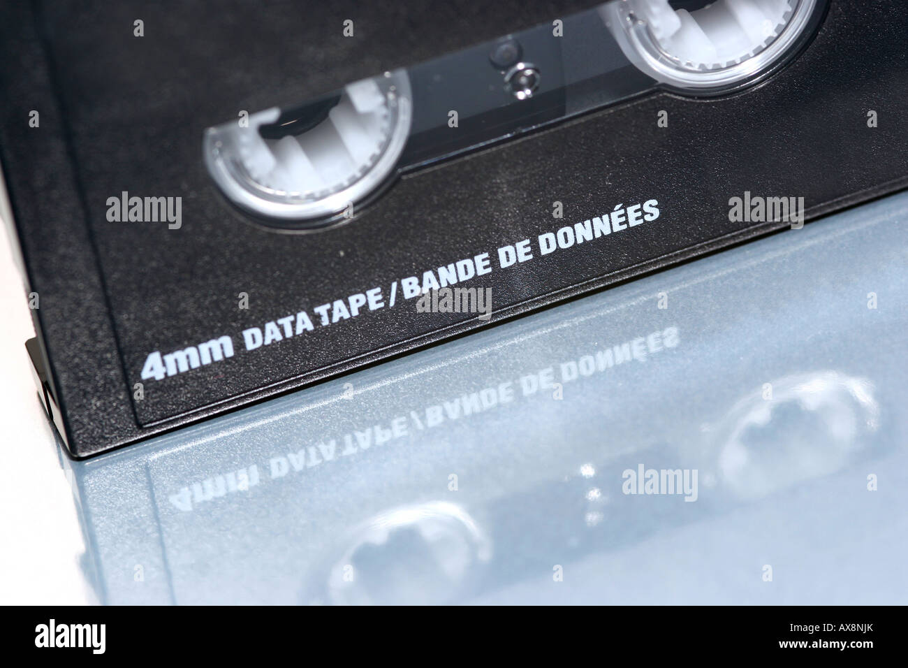 back up data tape 4mm on reflective white background Stock Photo