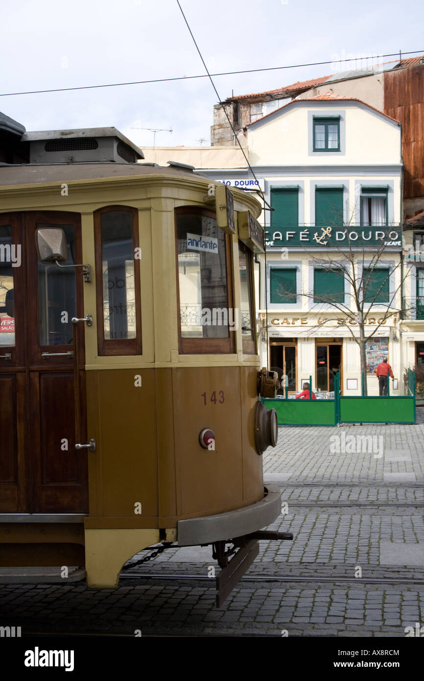 Old Tram on cobbled street in Porto Portugal Stock Photo