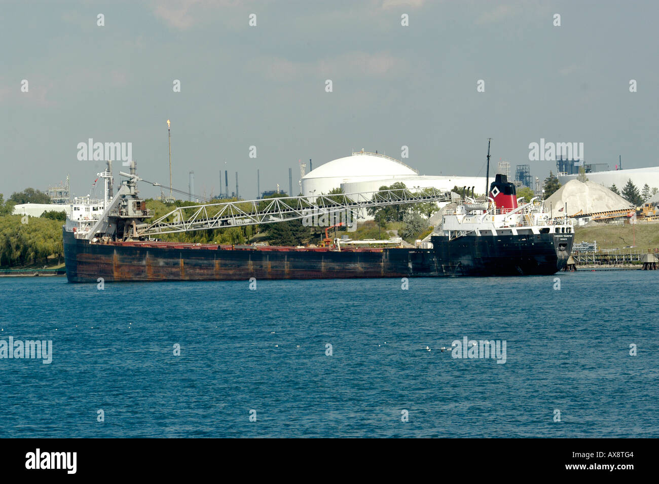 Ship off loads cargo on the Great Lakes at the St Clair River in Port