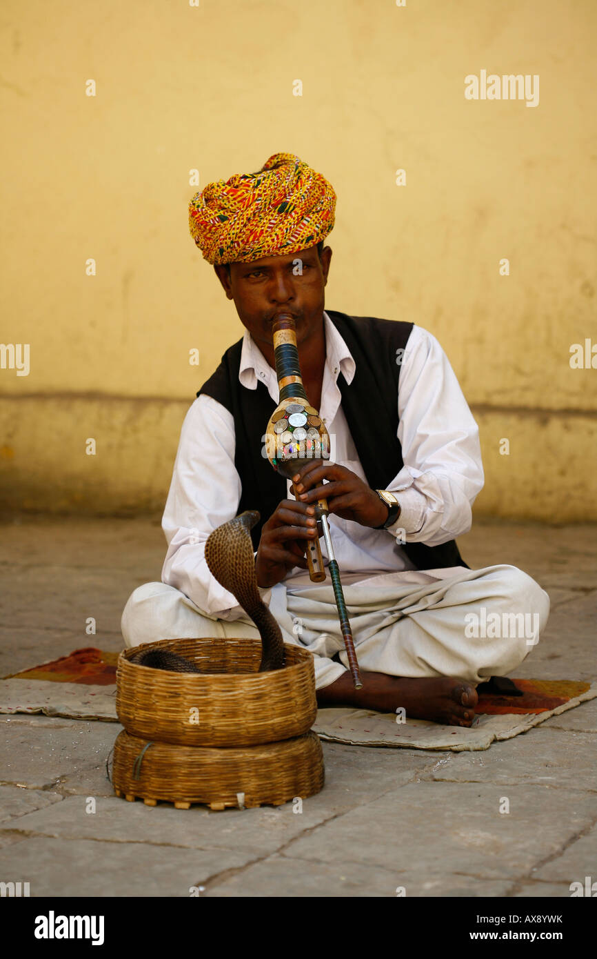 A snake charmer outside the city palace in Jaipur Rajasthan. Picture by James Boardman Stock Photo