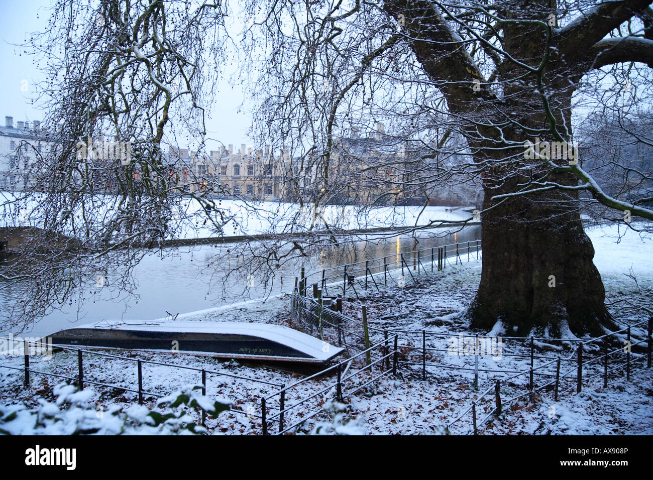 'Clare college Cambridge' and the 'River Cam' with an upturned punt in the snow, 'Cambridge university' Stock Photo