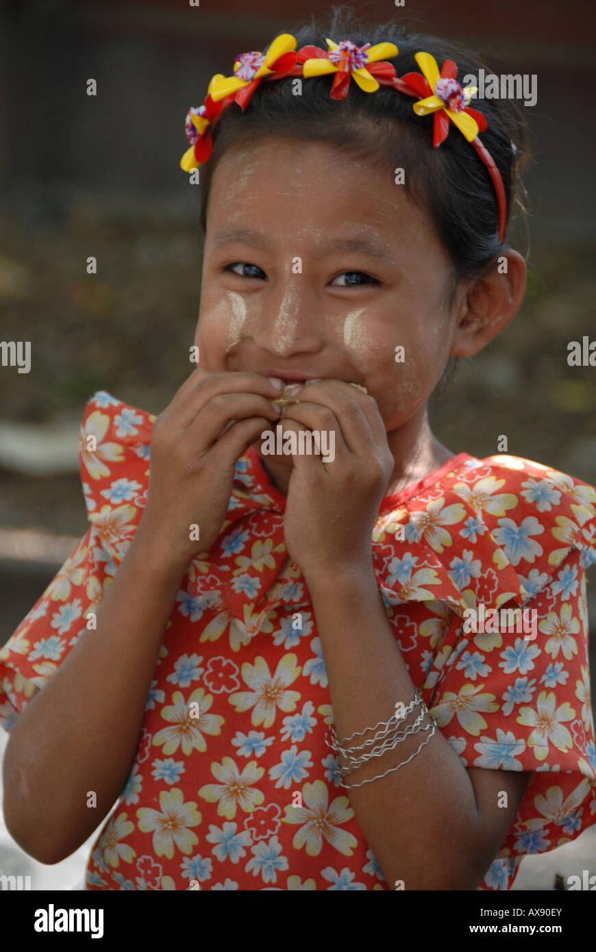 Burmese little girl with tanaka powder on her lovely face , rangoon,  burma (myanmar) Stock Photo