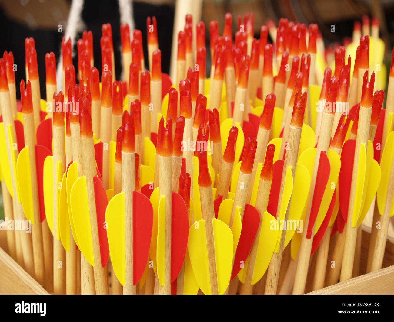 archers red yellow container arrows shafts feather Stock Photo