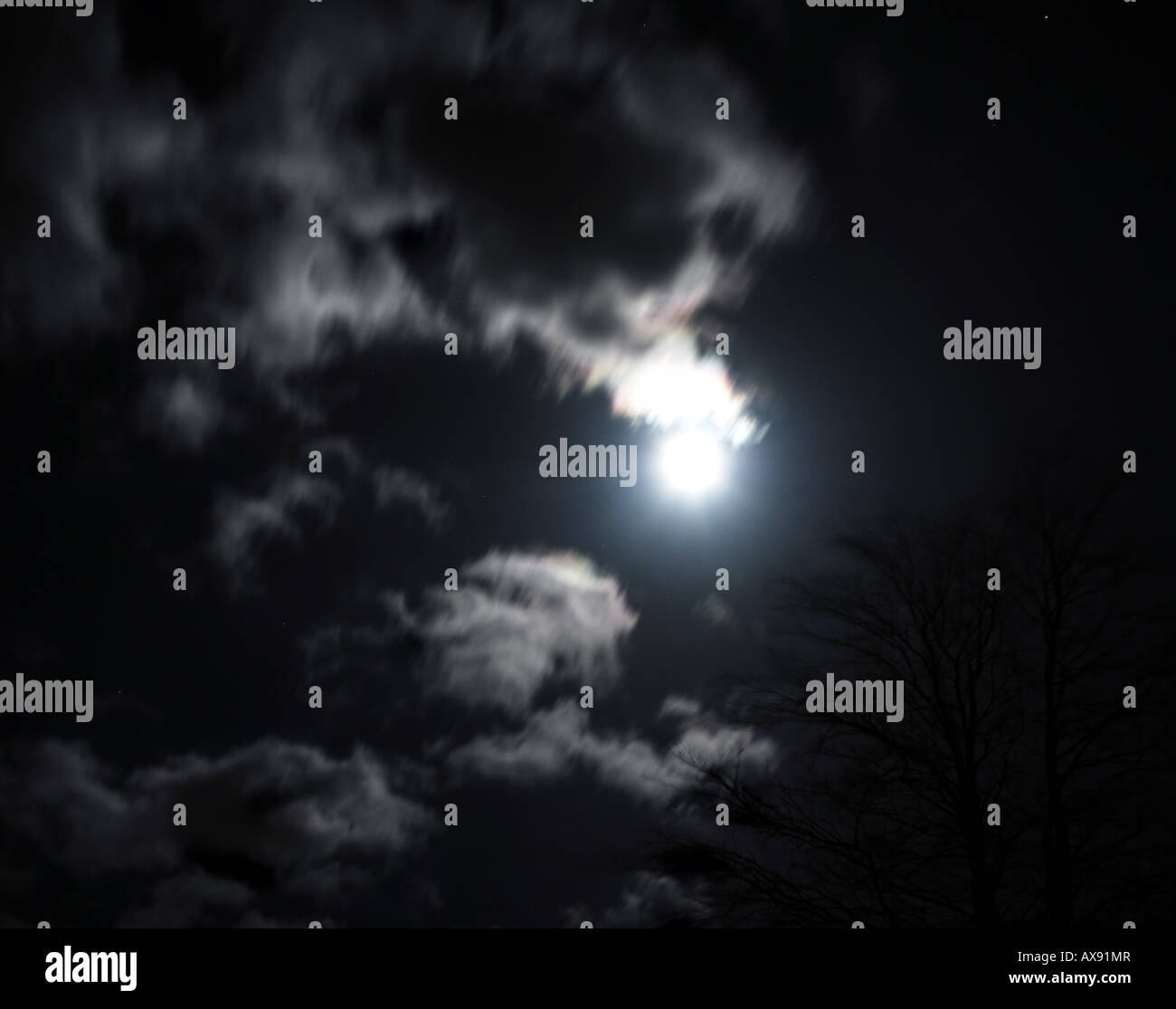 Moon (at the vernal equinox) peeping out from behind beautiful clouds