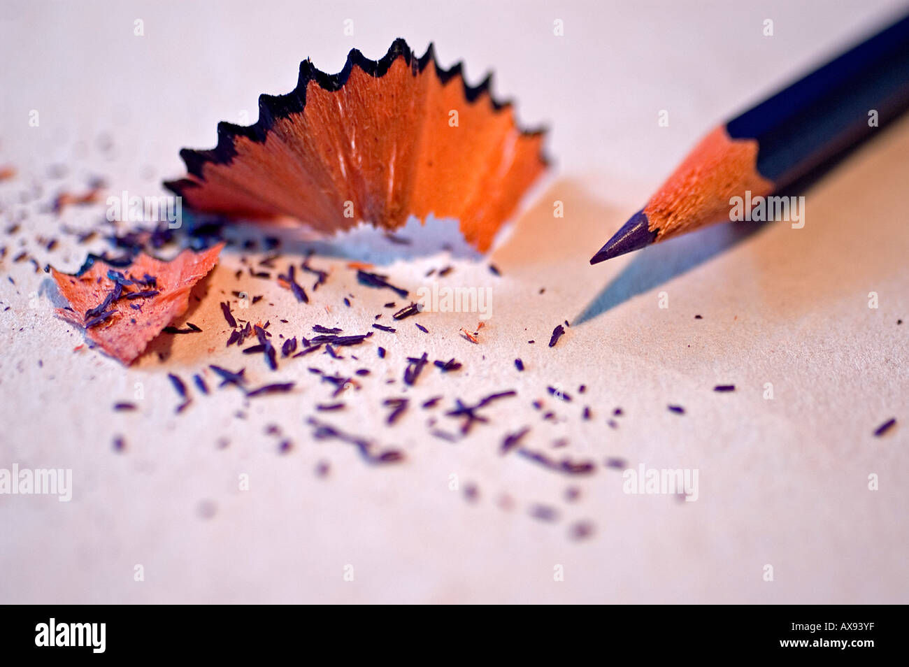 Sharpened pencil and scraps on white background Stock Photo - Alamy