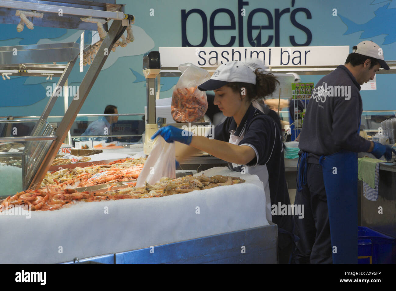 Workers selling seafood at Sydney Fish Market Sydney Australia Stock ...