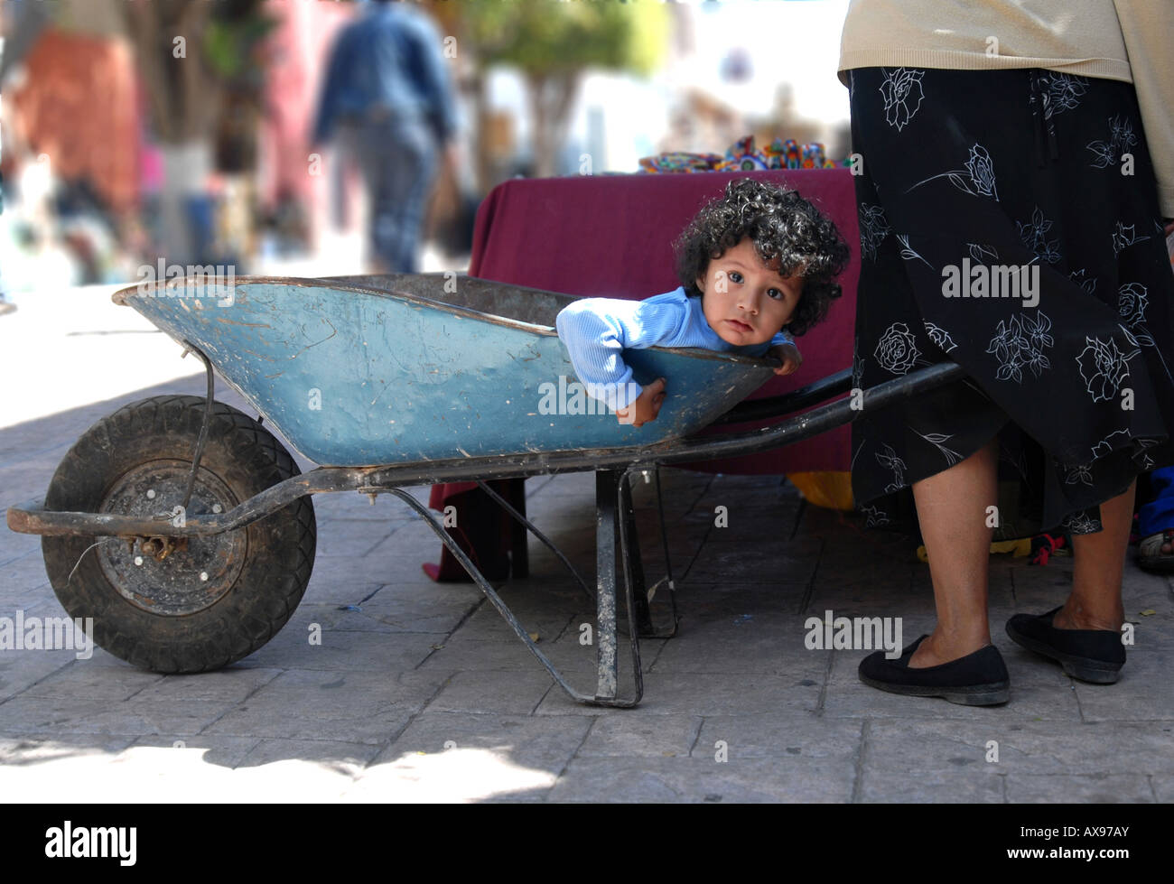 Young Boy in Wheelbarrow Stock Photo - Alamy