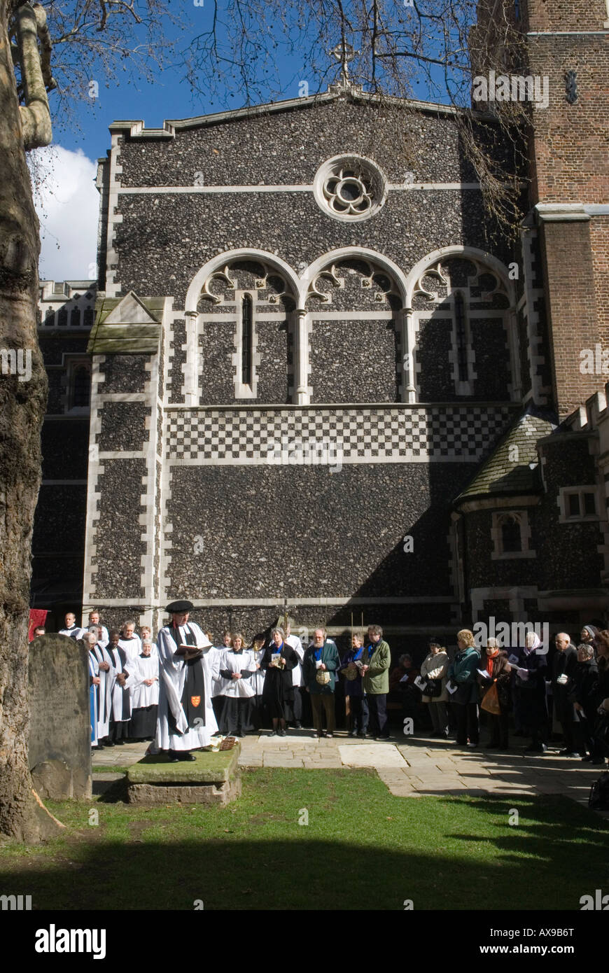 Butterworth Charity Easter Good Friday Priory Church of St Bartholomews the Great London UK 2008 Sermon standing  on a gravestone slab. Stock Photo