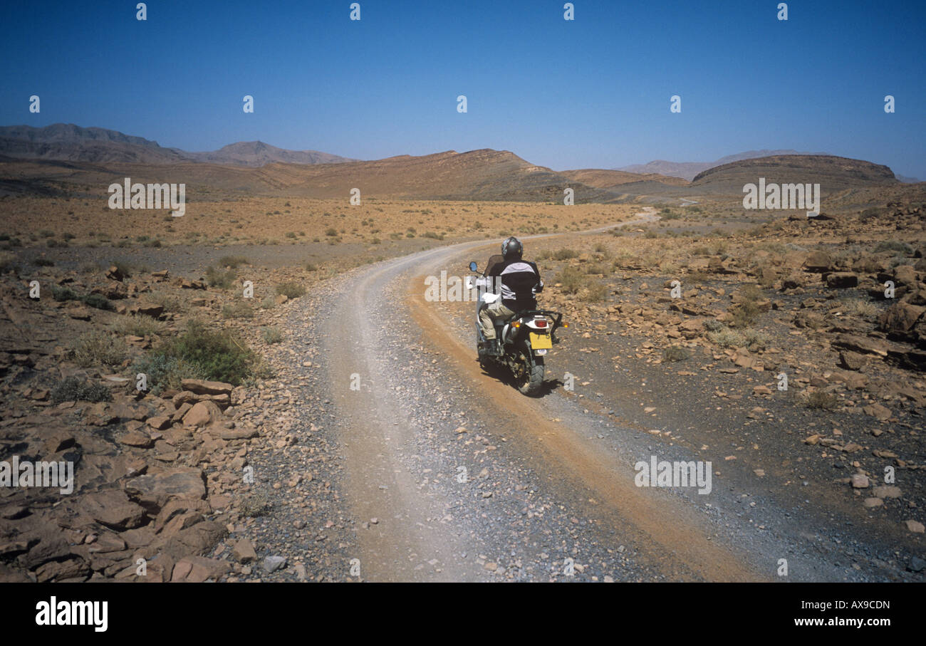motorbiking near Tata on the saharan plain Southern Morocco Stock Photo