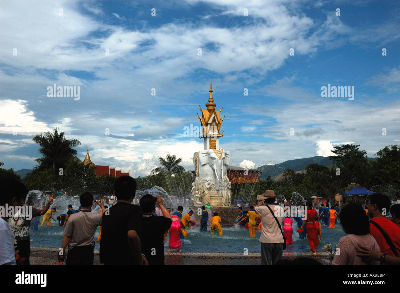 Festival in a Dai village, people splash water at each other for good luck. Xishuanbanna, Yunnan, China. Stock Photo