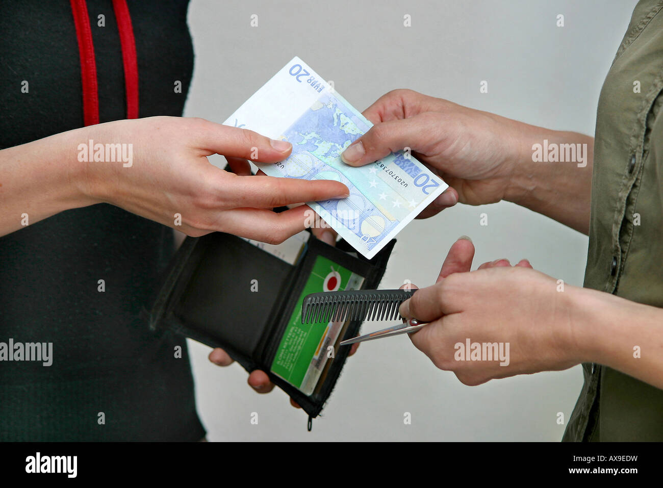 Hairdresser taking money Stock Photo Alamy