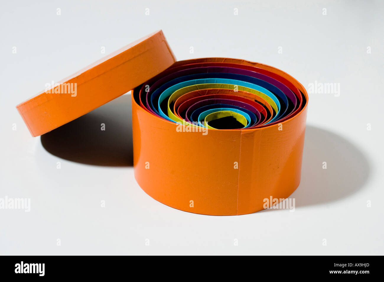 round colourful gift boxes of different sizes one inside the other with