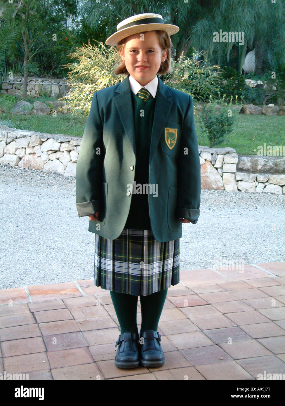 girl (age 5) in school uniform Stock Photo