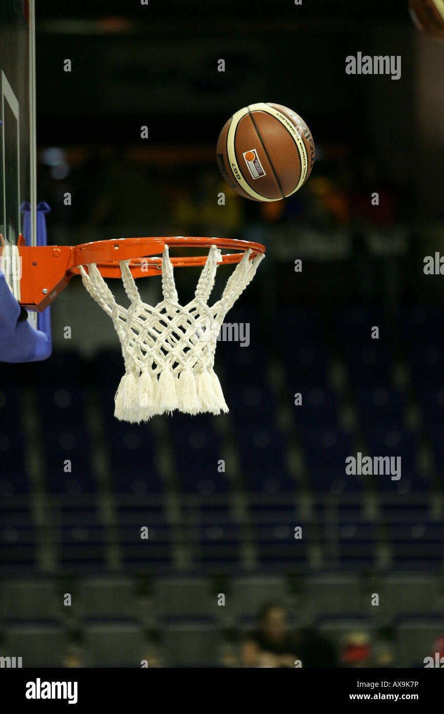 Basketball flying into a basketball hoop Stock Photo Alamy