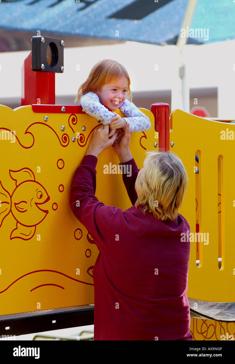 Little girl plays with supervisor of playground at Providence Speech