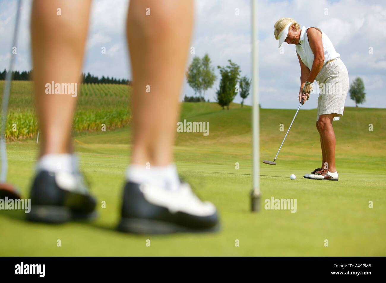 Elder Couple playing Golf, Bad Griesbach Bavaria Germany Stock Photo
