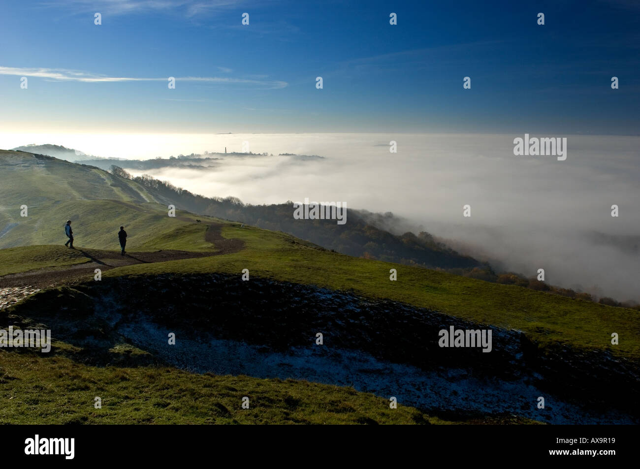Walkers on the Malvern Hills shrouded in fog Stock Photo