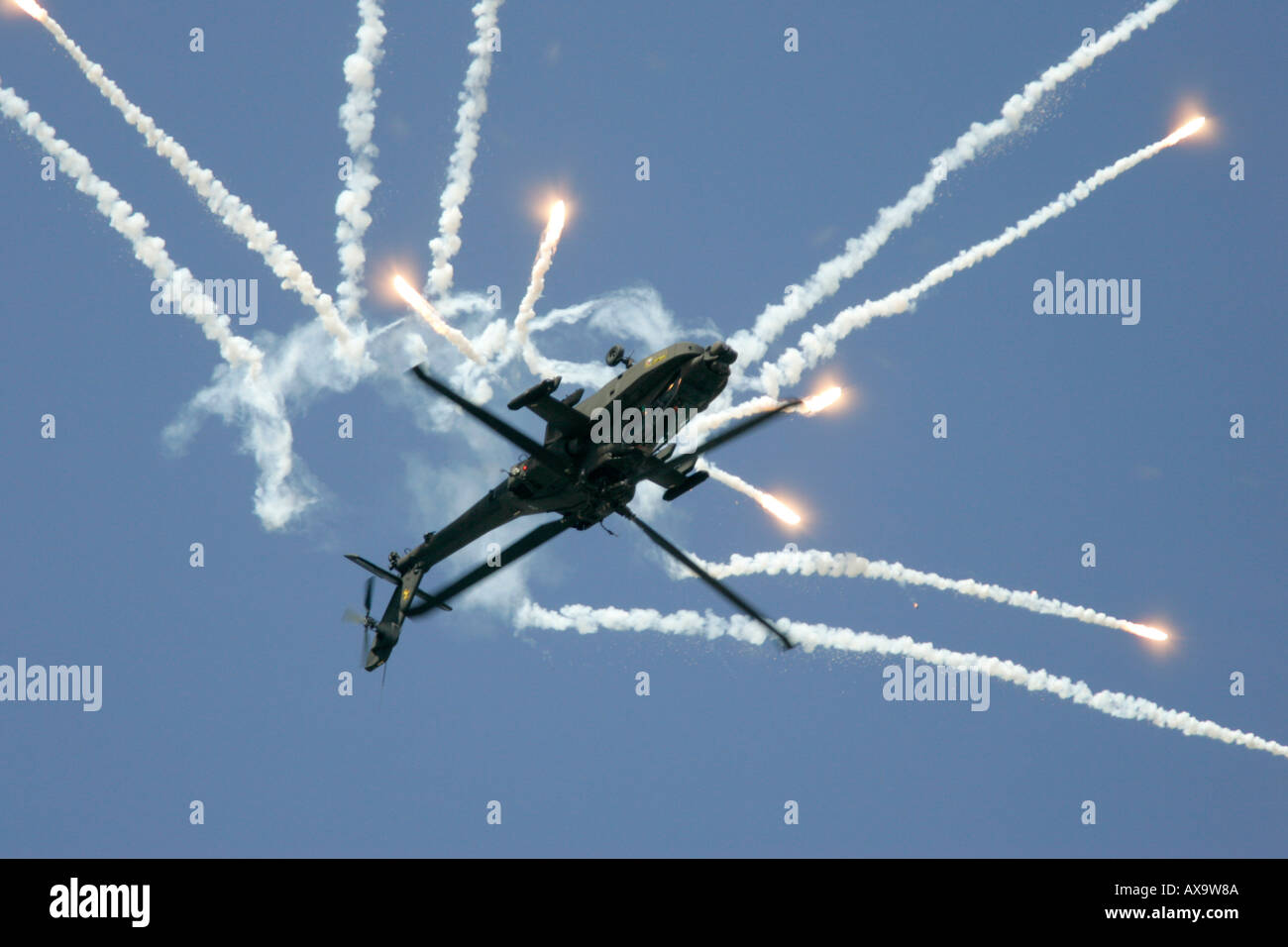 Royal Netherlands Air Force Apache AH 64D firing decoy flares RIAT 2005 RAF Fairford Gloucestershire England UK Stock Photo