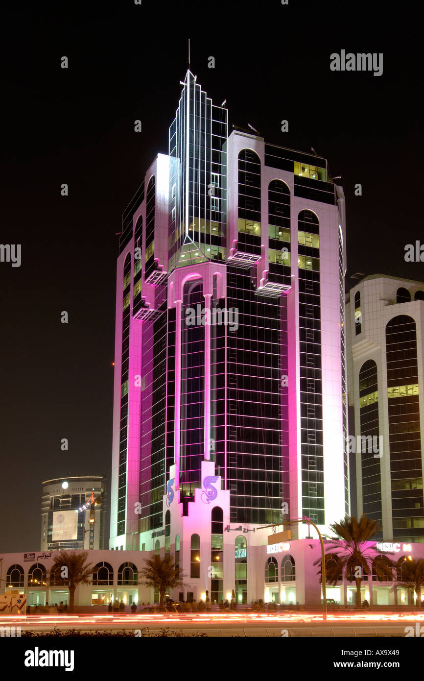 The Salam Tower illuminated at night on Doha's west bay in Qatar. Stock Photo