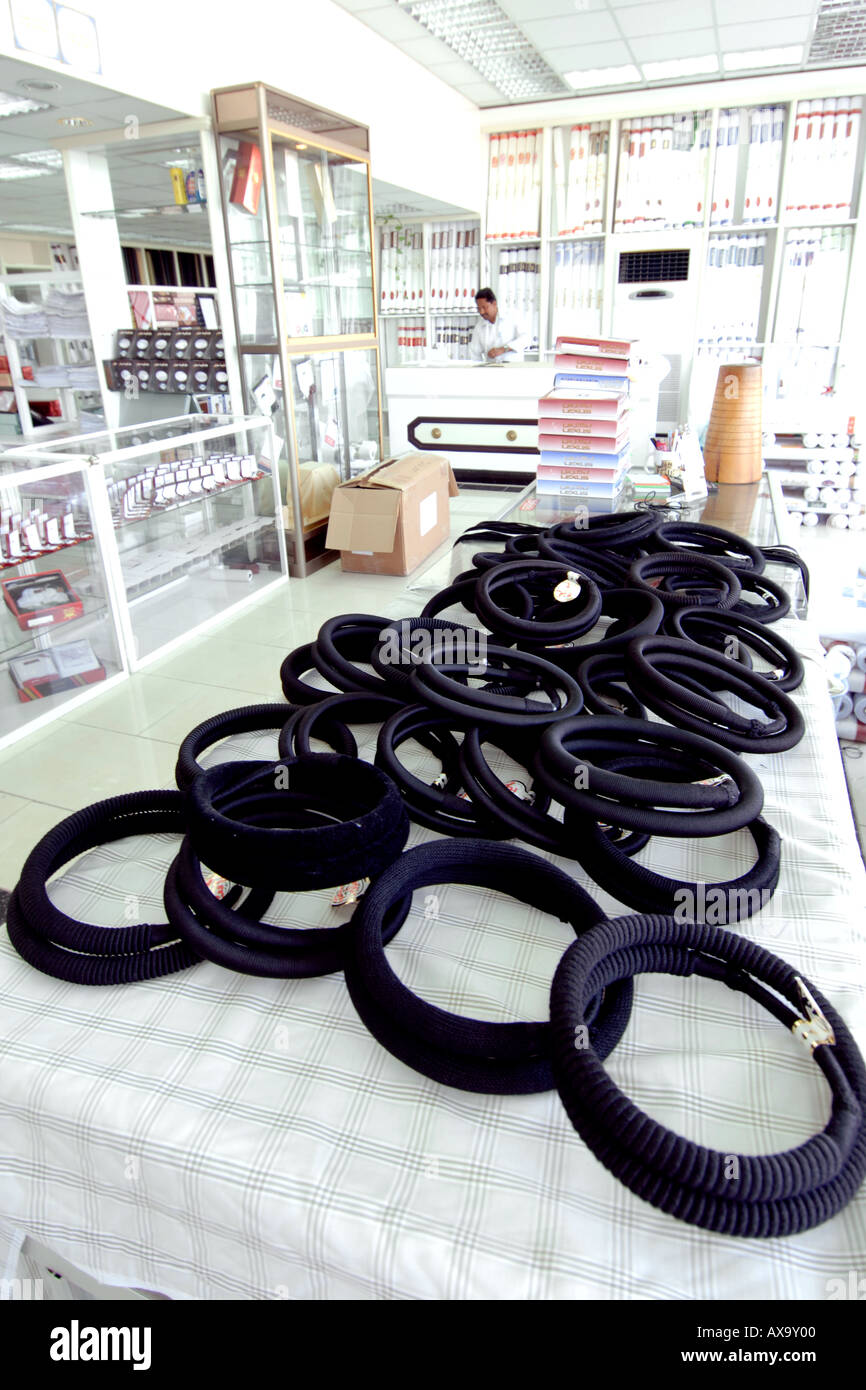 Interior of a fabric merchant showing a selection of headdresses for