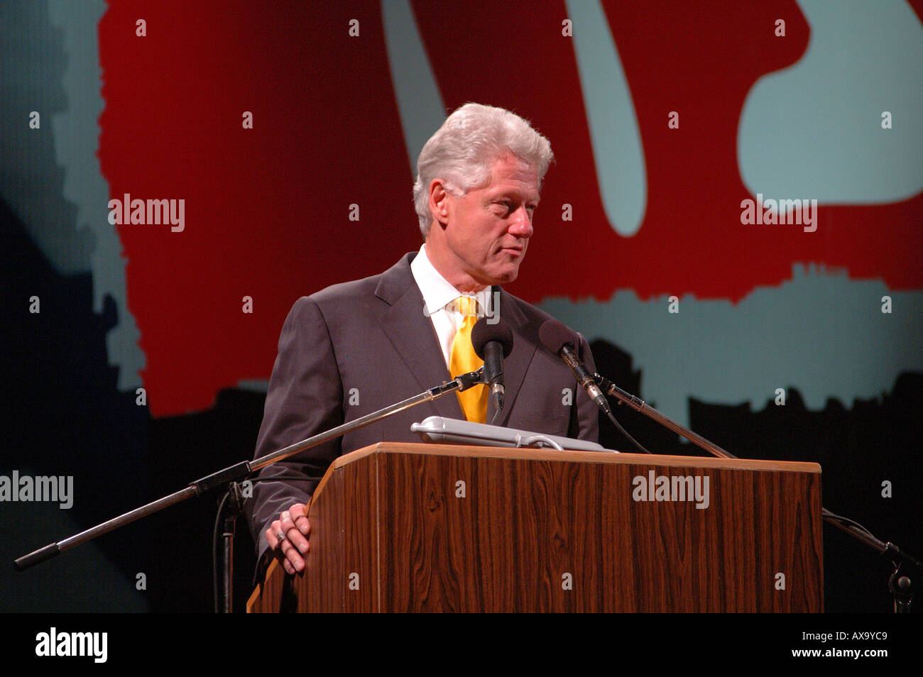 Former American President Bill Clinton at podium making a speech Stock Photo