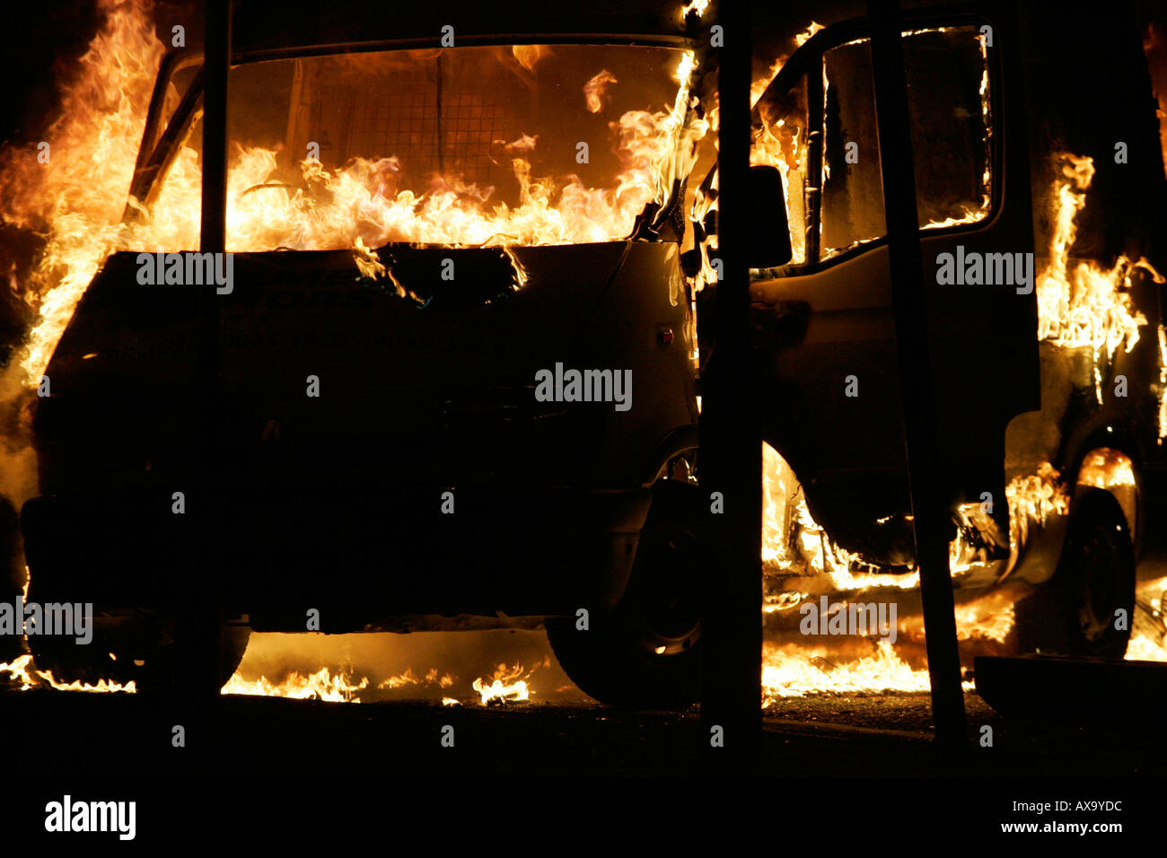 Van burning as roadblock during loyalist rioting and violence north belfast northern ireland Stock Photo
