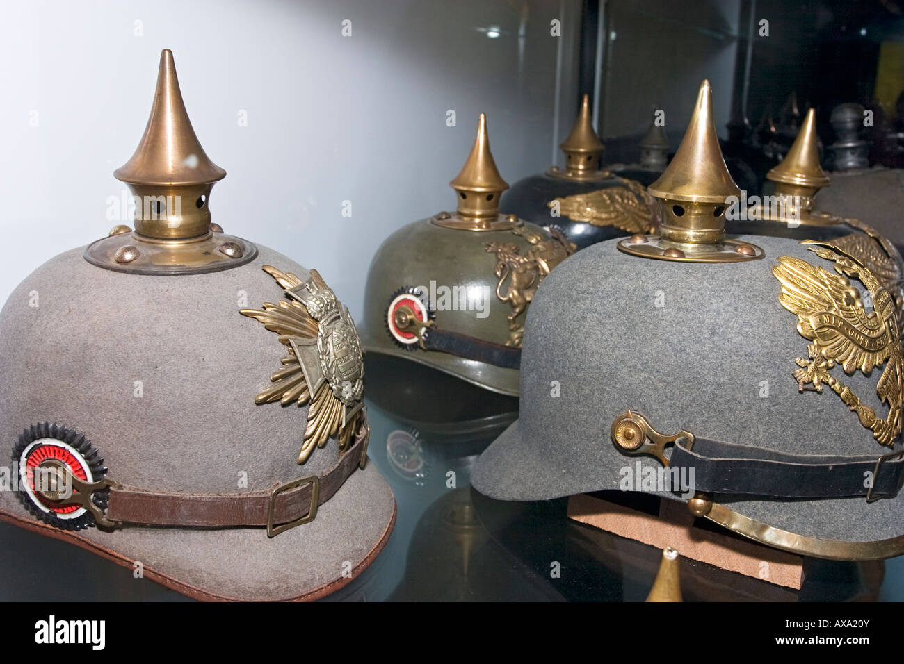 Spiked German WW1 helmets exhibit inside Passendale Museum near Ypres Belgium Stock Photo