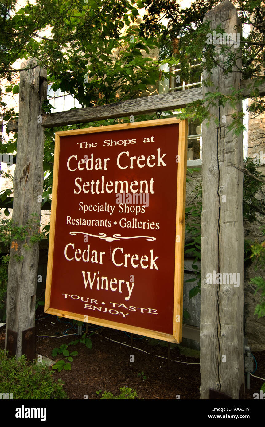 Sign for Cedar Creek Settlement a shopping area in a restored mill in Cedarburg Wisconsin Stock Photo