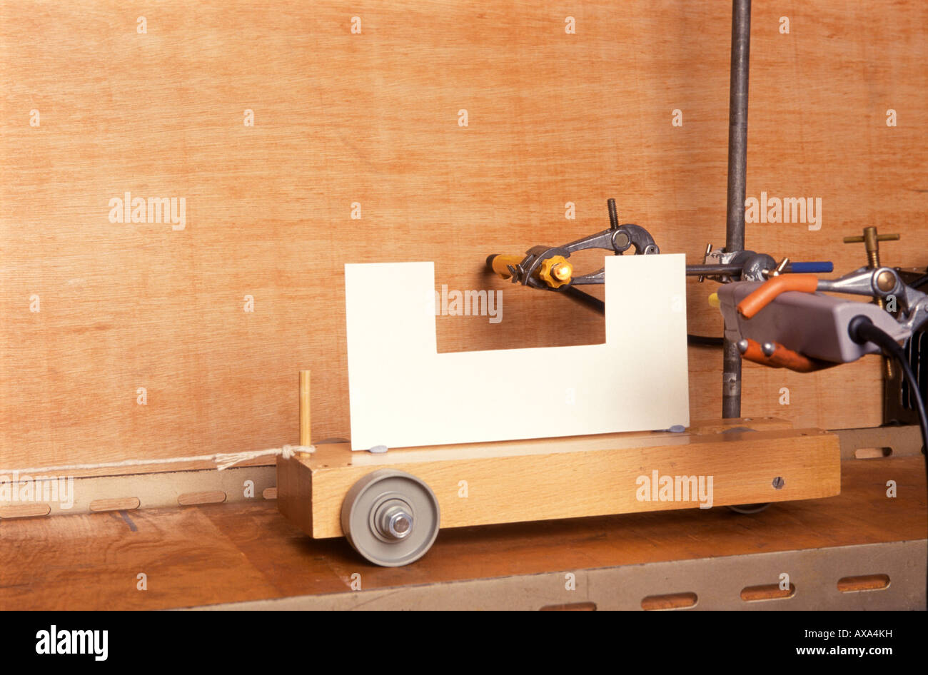 A dynamics trolley passing through a light gate Stock Photo