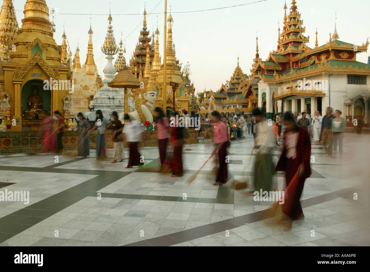 women sweeping to gain merit for the next life, Shwedagon Pagoda, Yangon, Myanmar Stock Photo