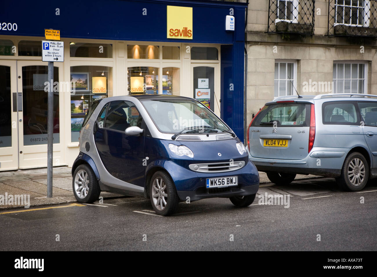 A 'Smart' car parked sideways in a parking bay in Lemon Street, Truro, Cornwall Stock Photo