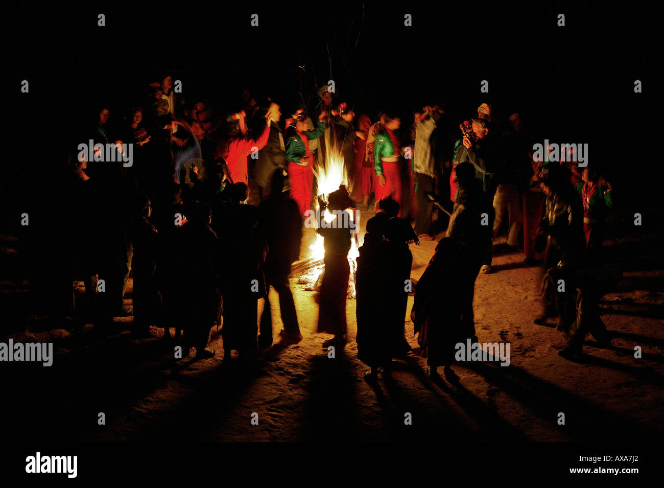dancing round campfire, Palaung hill tribe, Yasakyi Hills, Myanmar Stock Photo