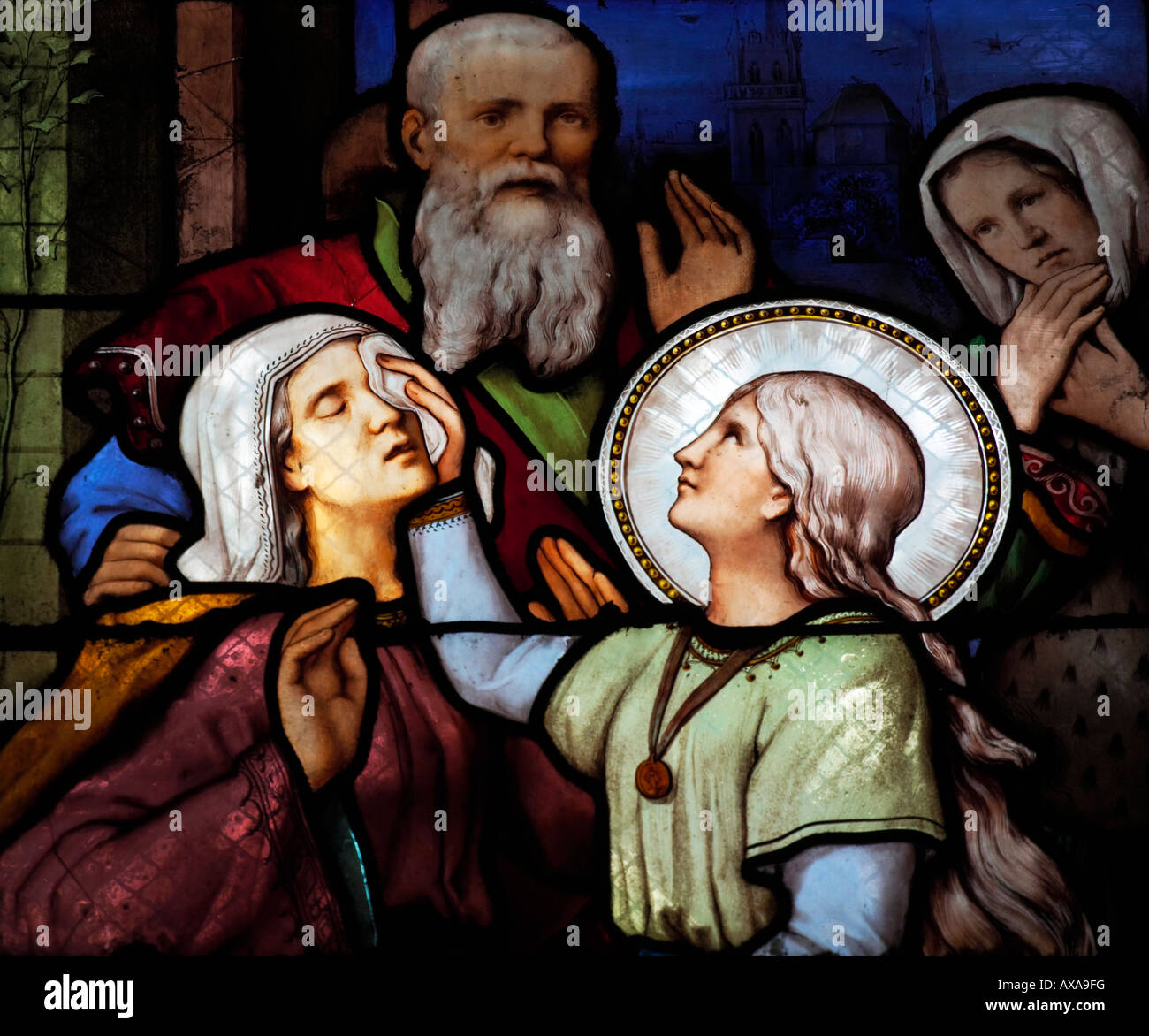 St Genevieve returns the sight of her mother stained glass window at St Severin church Paris France Stock Photo