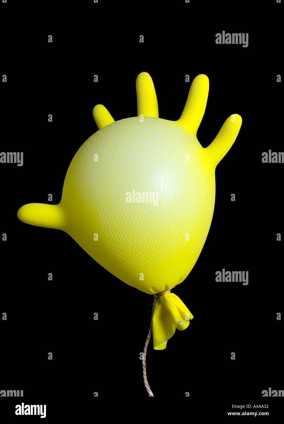 inflated yellow rubber glove Stock Photo