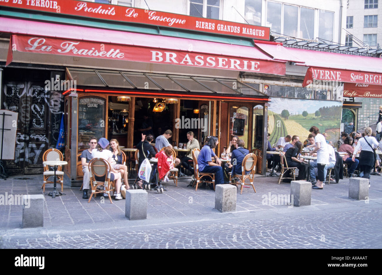 Patrons at a sidewalk cafe Paris France Stock Photo