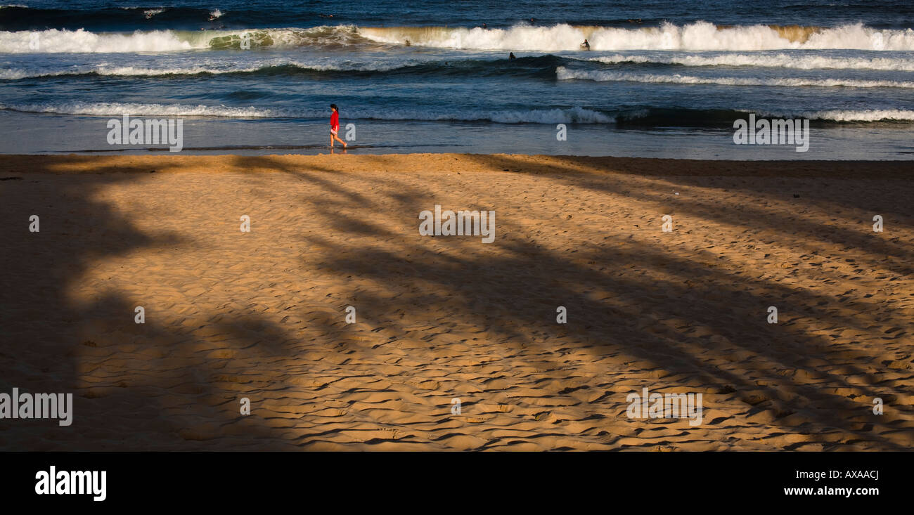 Girl walks on beach Stock Photo