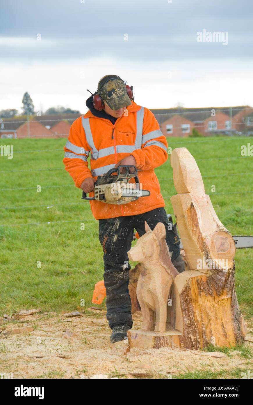 A Wood Carver Using a Chainsaw Stock Photo Alamy