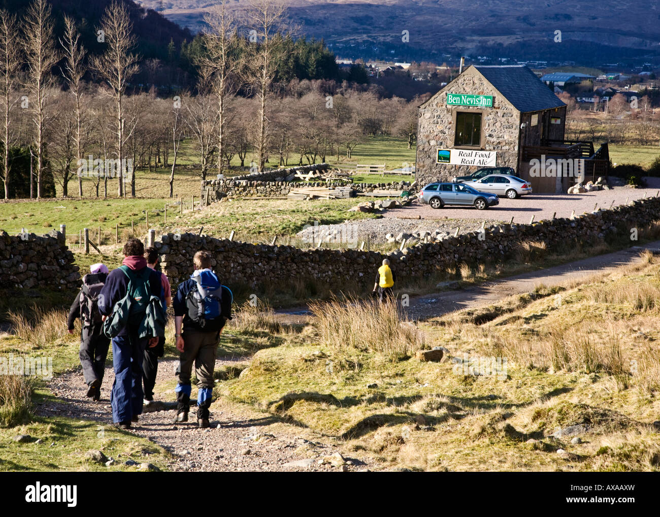 A group of hill walkers decending Ben Nevis and heading towards the Ben nevis Inn, Scotland. Stock Photo