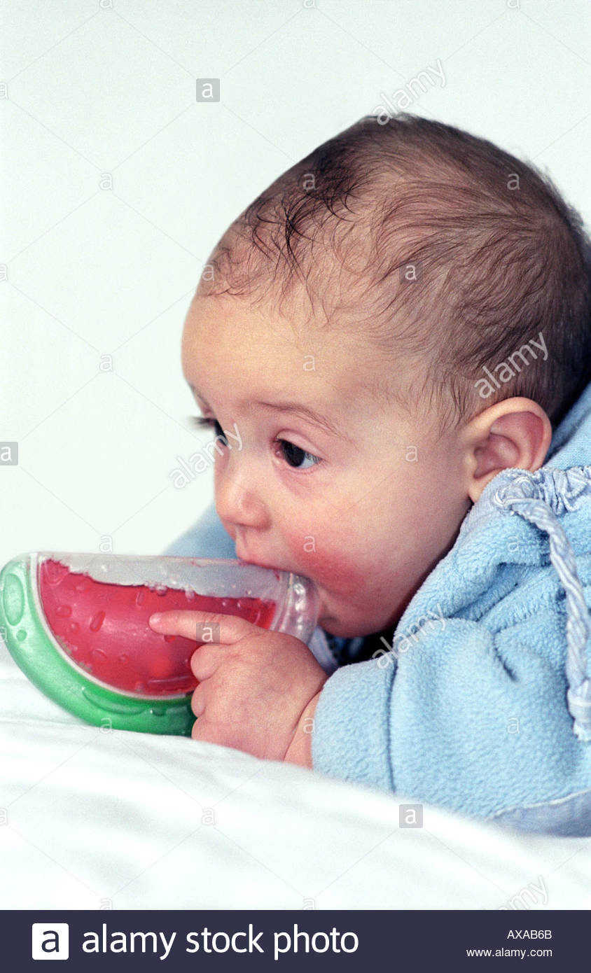 baby chewing on dummy