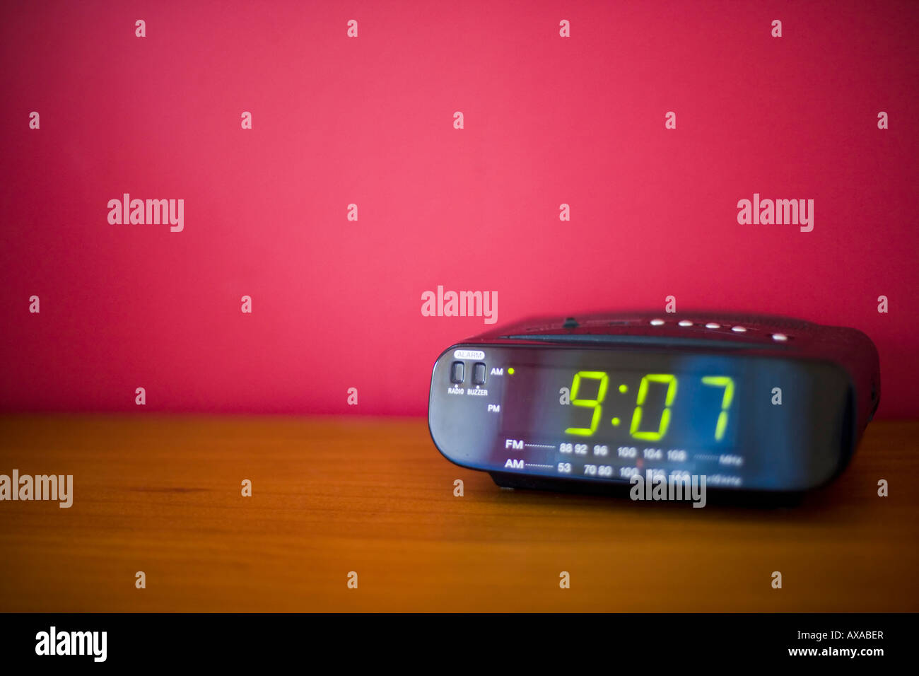 Bedside LED clock with alarm radio time 9 07 Stock Photo Alamy