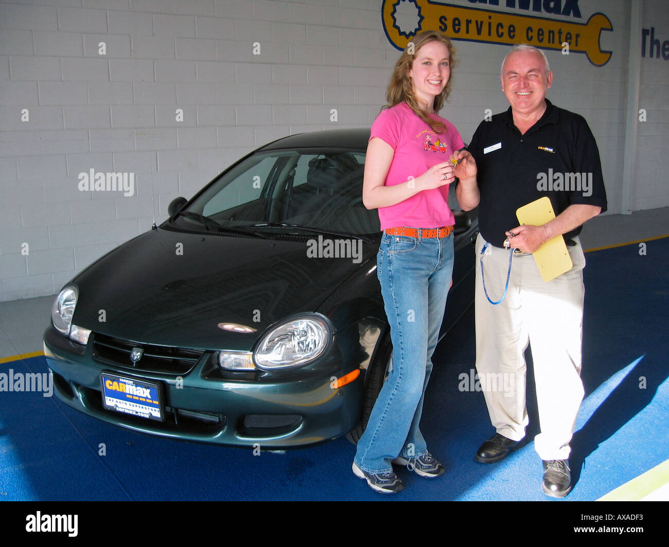Teenage girl receives keys to new car USA Stock Photo