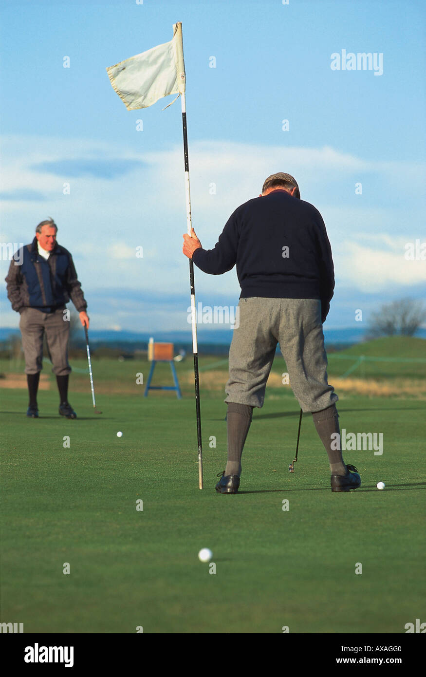 Two men playing golf, St. Andrews, Scotland, Great Britain, Europe Stock Photo