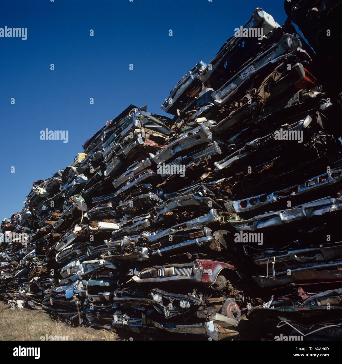 Piles of crushed big North American cars awaiting recycling in Toronto