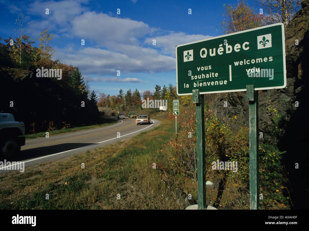 Roadside sing welcomes drivers to the Provence of Quebec in French and English near Portage du Fort CANADA Stock Photo