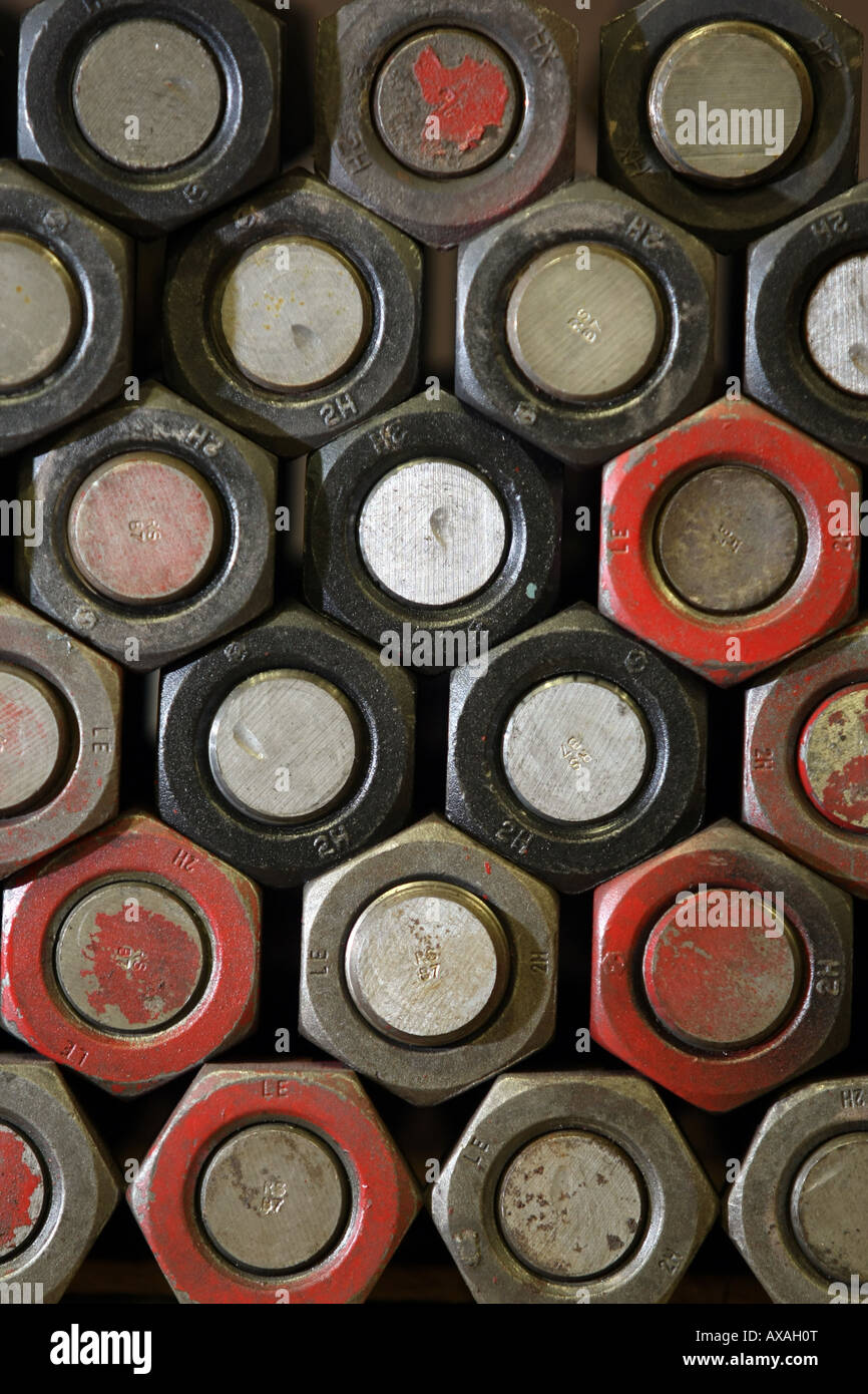 A stack of large multi coloured nuts and bolts Stock Photo Alamy