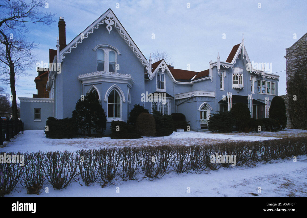 Rendered Wooden Neo Gothic style Victorian house with ached windows and ornate bargeboards Kingston Ontario Canada Stock Photo