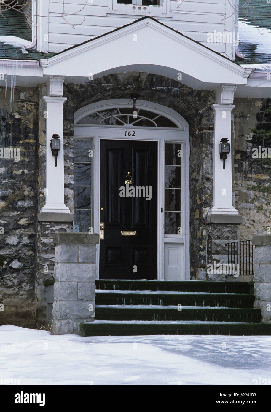 Colonial Georgian style limestone house with arched window over doorway Kingston Ontario Canada Stock Photo